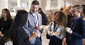 Delegates Networking During Conference Lunch Break