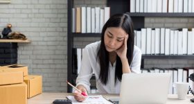 Desperate businesswoman worried in office