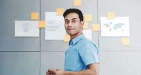 Portrait of Happy Young Asian Businessman in Office Meeting Room