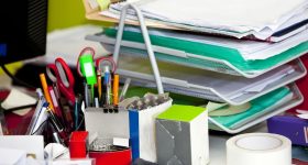 Close-up of real life messy desk in office